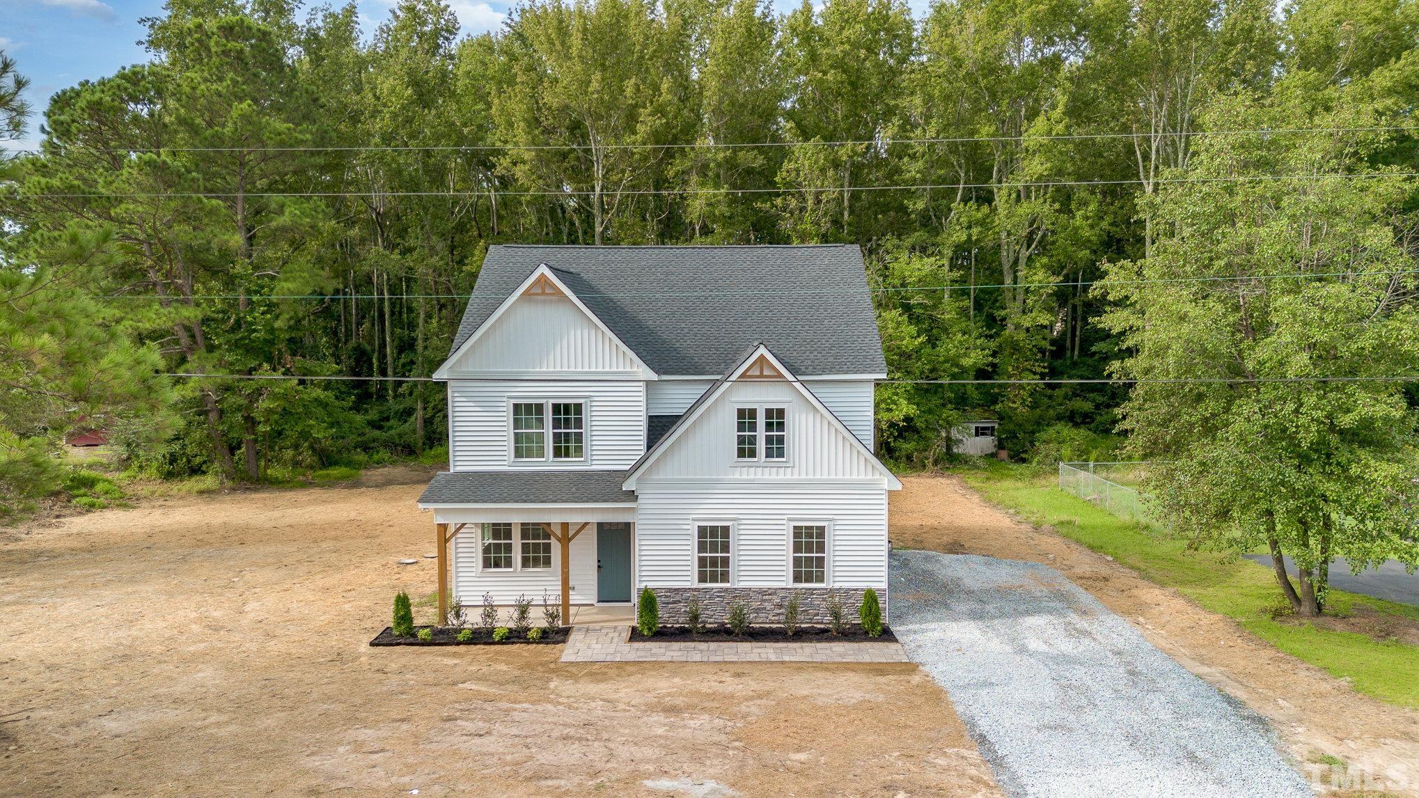 1291 Massengill Pond Road Angier, NC 27501 - Photo 3 of 45 a house with trees in the background
