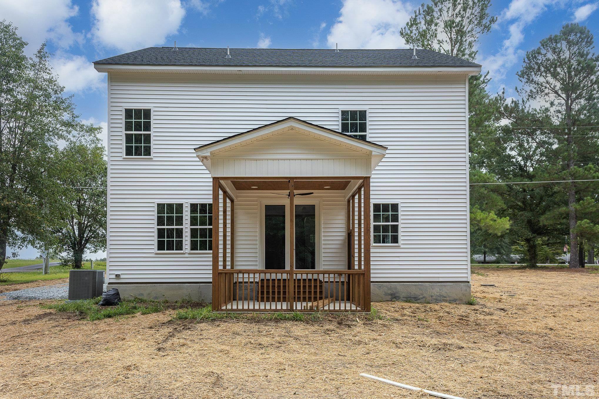 1291 Massengill Pond Road Angier, NC 27501 - Photo 35 of 45 a front view of a house with a garden