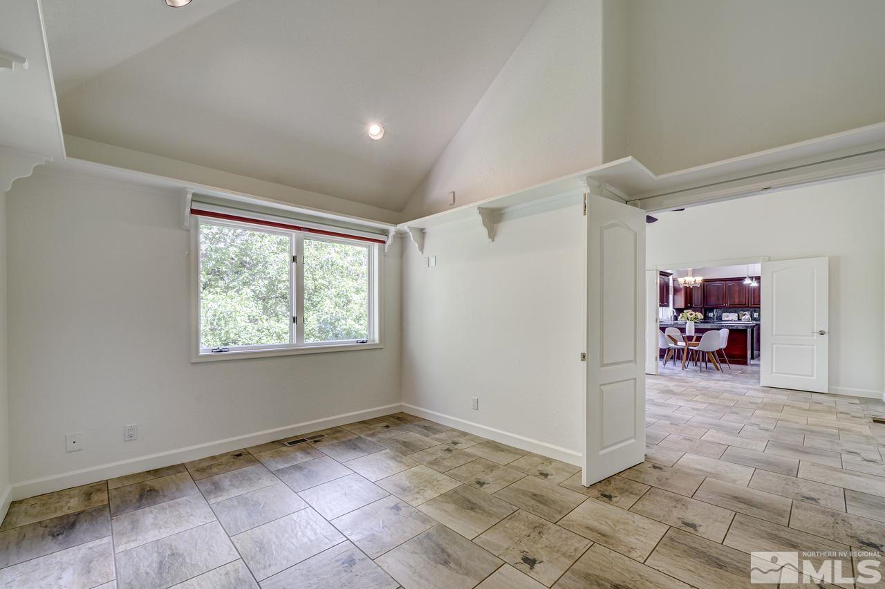 4286 Caughlin Parkway Reno, NV 89519 - Photo 11 of 25 a view of a livingroom with workspace and a window