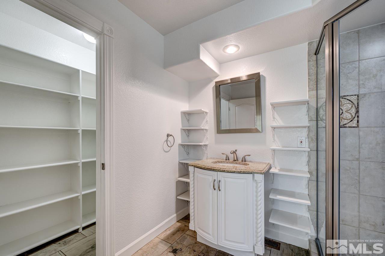 4286 Caughlin Parkway Reno, NV 89519 - Photo 12 of 25 a bathroom with a sink and a mirror
