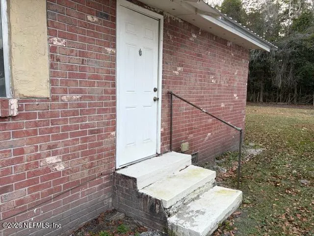 a brick house with a yard