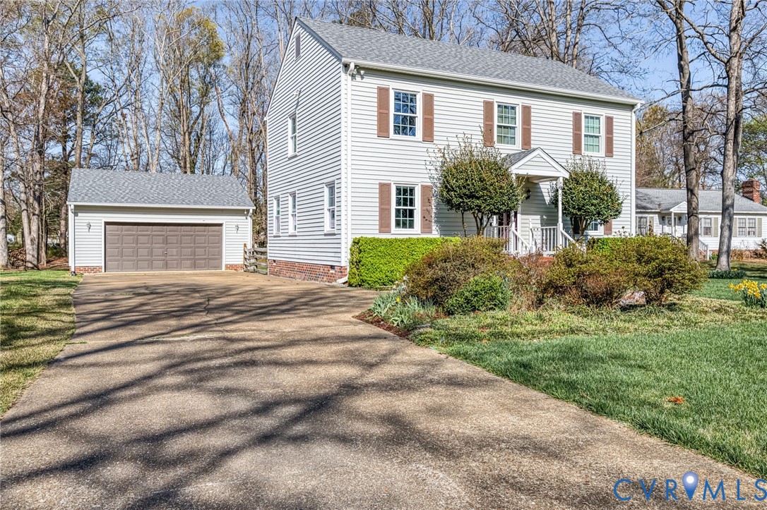 concrete driveway and climate controlled garage