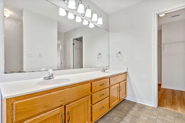 a white bath tub and a window