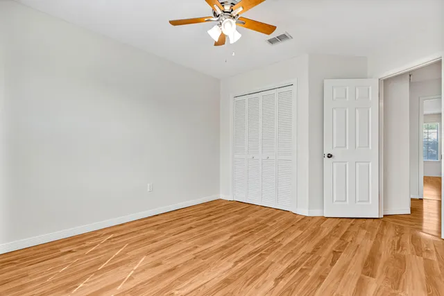 a view of a hallway with windows