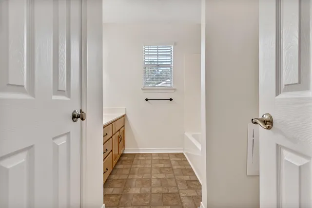 a bathroom with a sink a vanity and a mirror