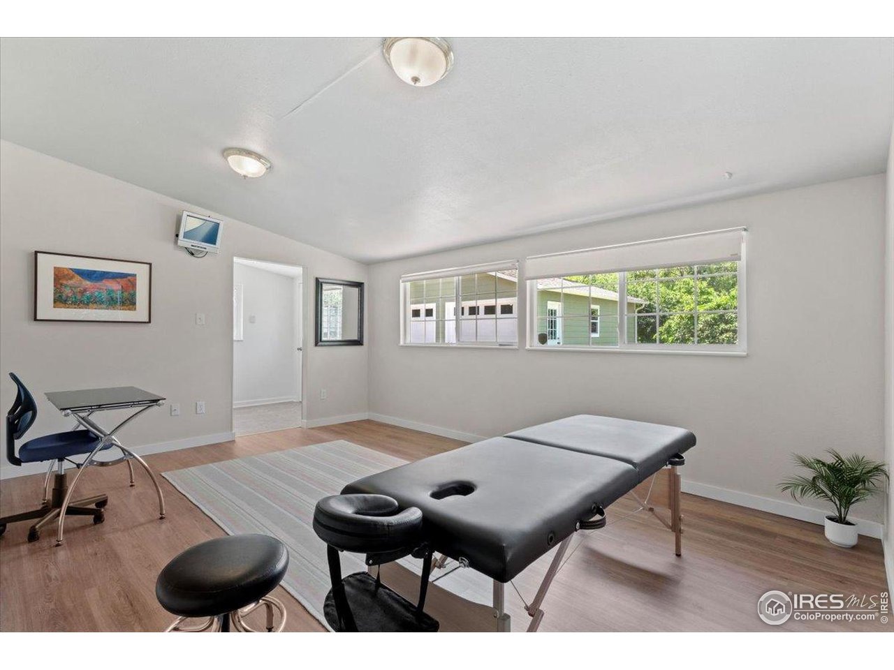 4125 Pierce Street Wheat Ridge, CO 80033 - Photo 23 of 45 a living room with furniture a rug and a window