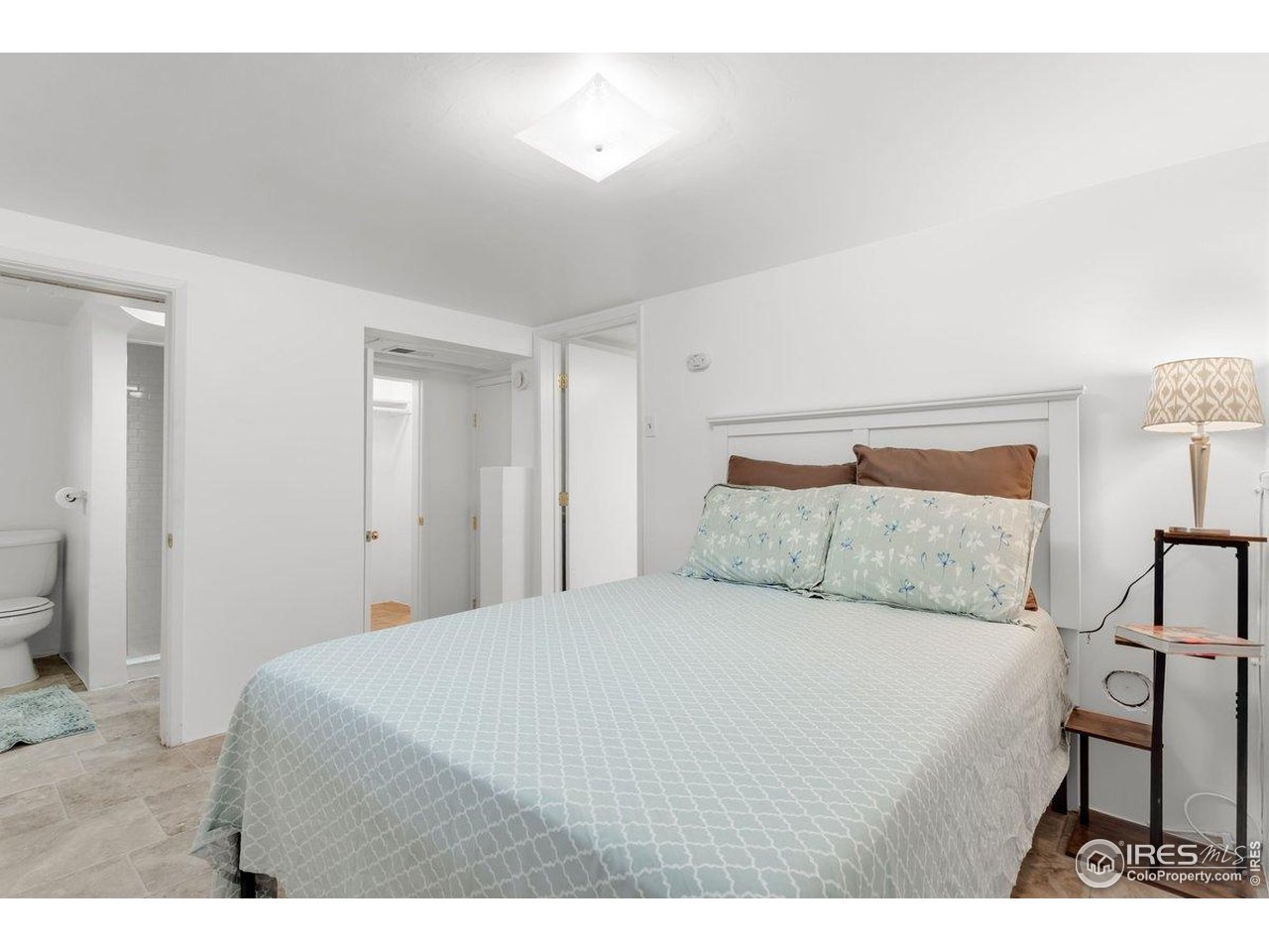 4125 Pierce Street Wheat Ridge, CO 80033 - Photo 26 of 45 a bedroom with a bed and a cabinets