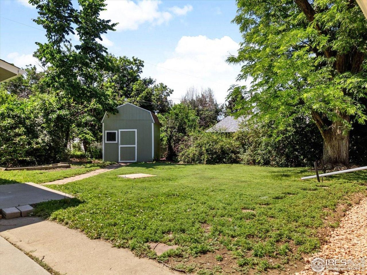 4125 Pierce Street Wheat Ridge, CO 80033 - Photo 31 of 45 a house with a trees in front of it