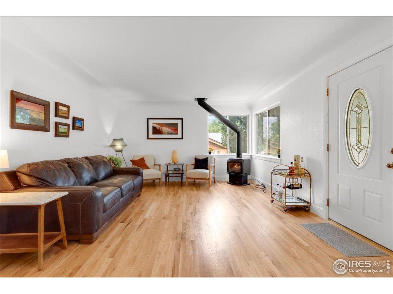4125 Pierce Street Wheat Ridge, CO 80033 - Photo 7 of 45 a living room with furniture and a table