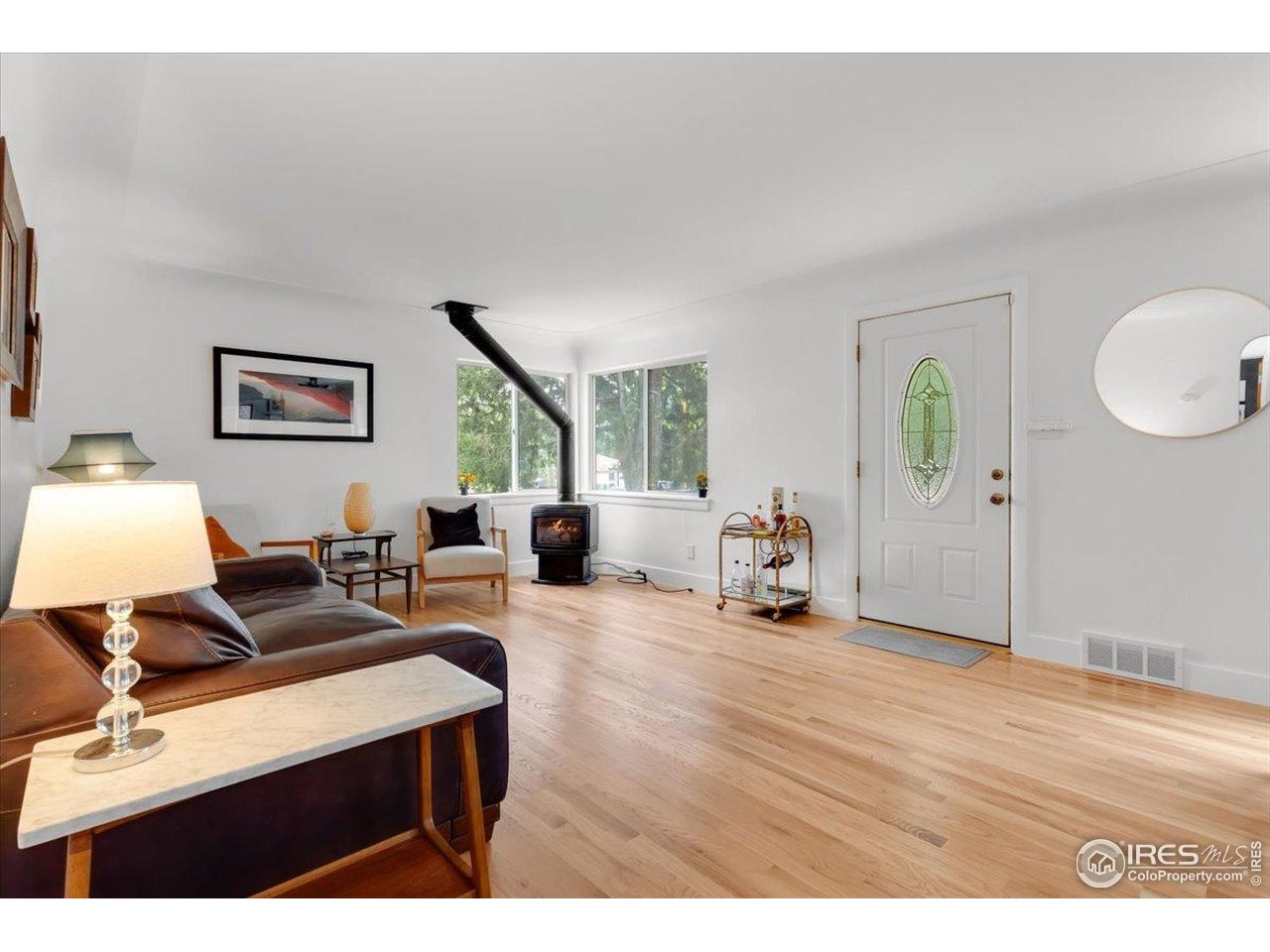 4125 Pierce Street Wheat Ridge, CO 80033 - Photo 8 of 45 a living room with furniture and a wooden floor
