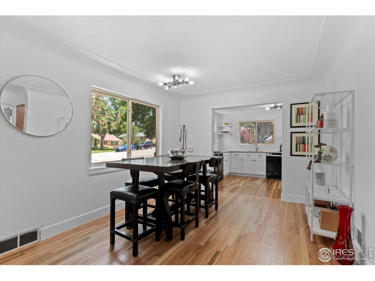 4125 Pierce Street Wheat Ridge, CO 80033 - Photo 9 of 45 a living room with furniture and a wooden floor