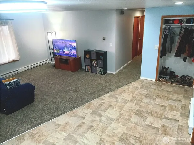 a bed room with a bed and a television