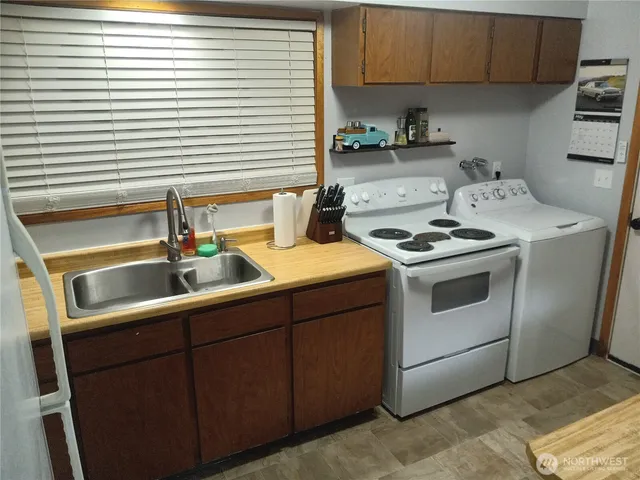 a kitchen with a stove and a sink