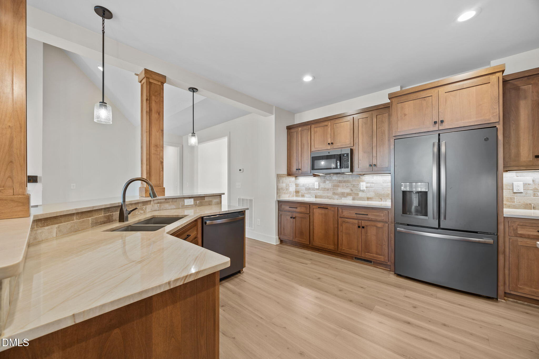 6450 Moores Mill Road Rougemont, NC 27572 - Photo 12 of 66 a kitchen with stainless steel appliances granite countertop a sink refrigerator and microwave