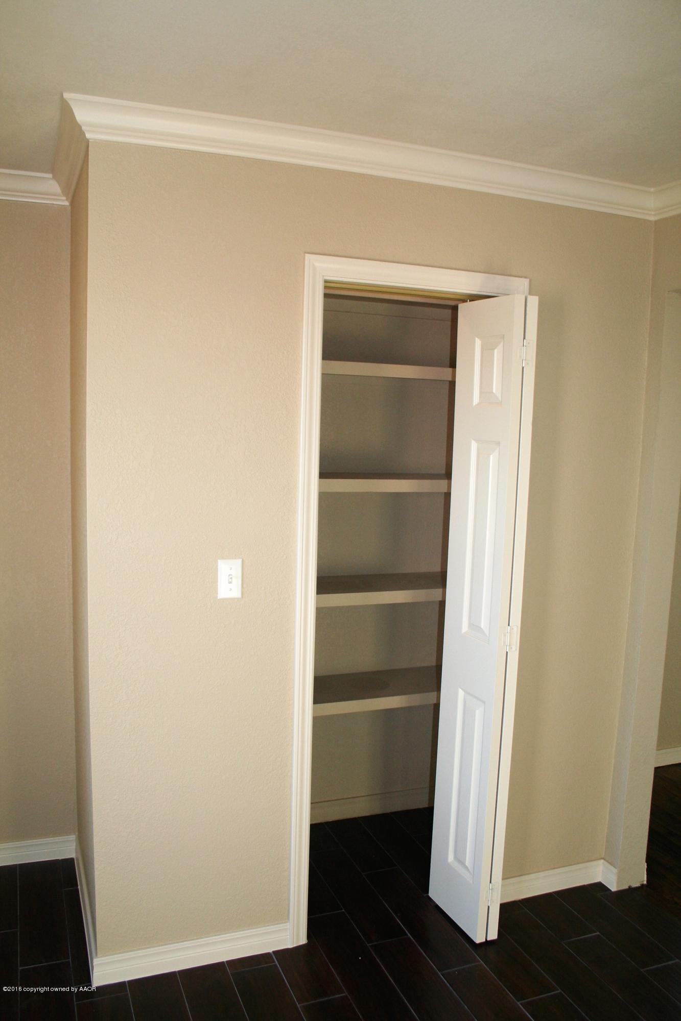 511 Southwest 45th Avenue Amarillo, TX 79110 - Photo 13 of 17 a view of walk in closet with empty racks