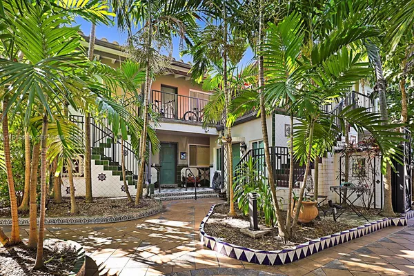 a view of a park with plants and trees
