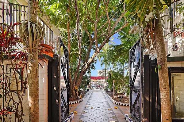 a backyard of a house with seating space and trees