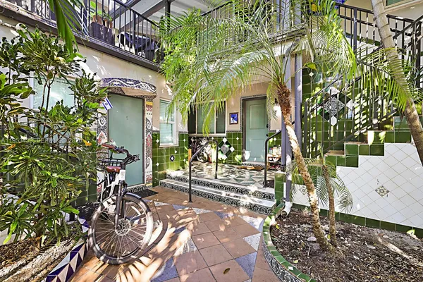 a view of house with outdoor space and sitting area