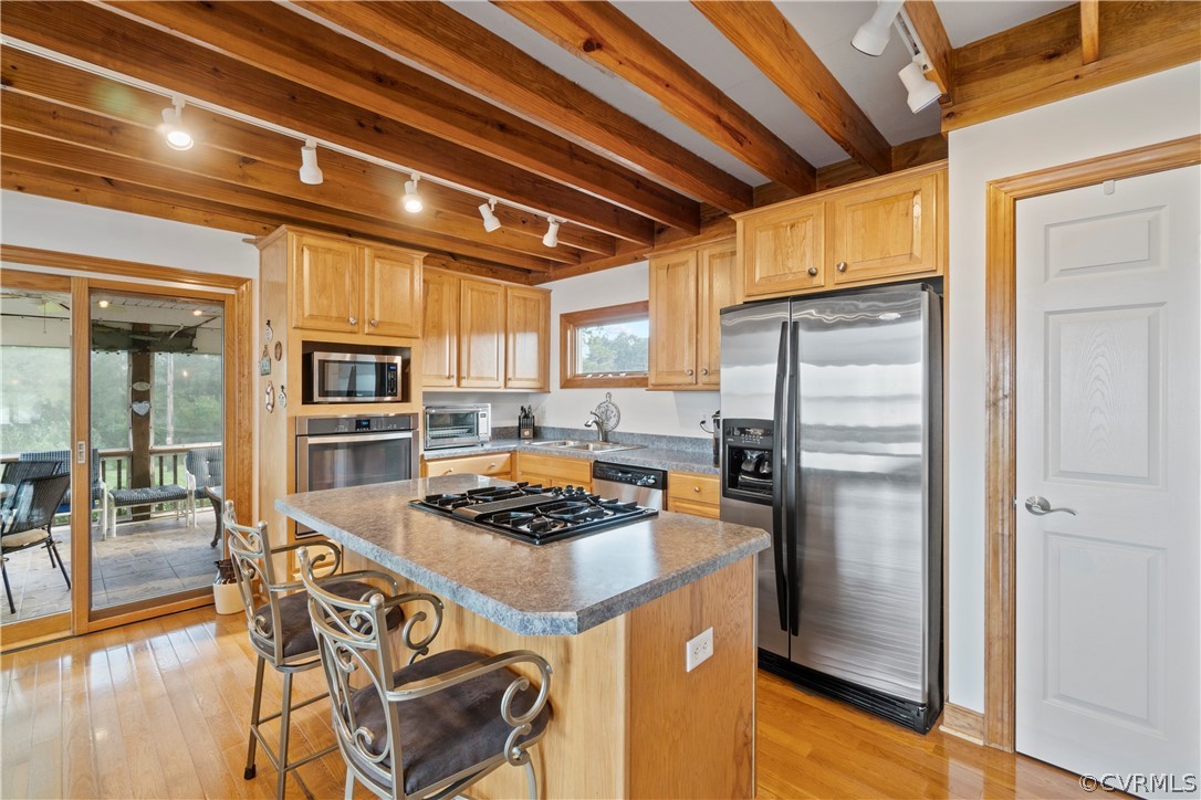 531 Shellfield Road Dunnsville, VA 22454 - Photo 9 of 46 An island seating for two with gas range top for c