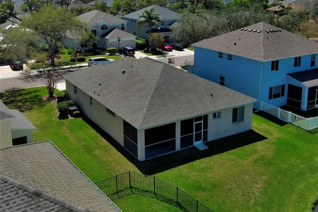 an aerial view of a house with swimming pool yard and outdoor seating