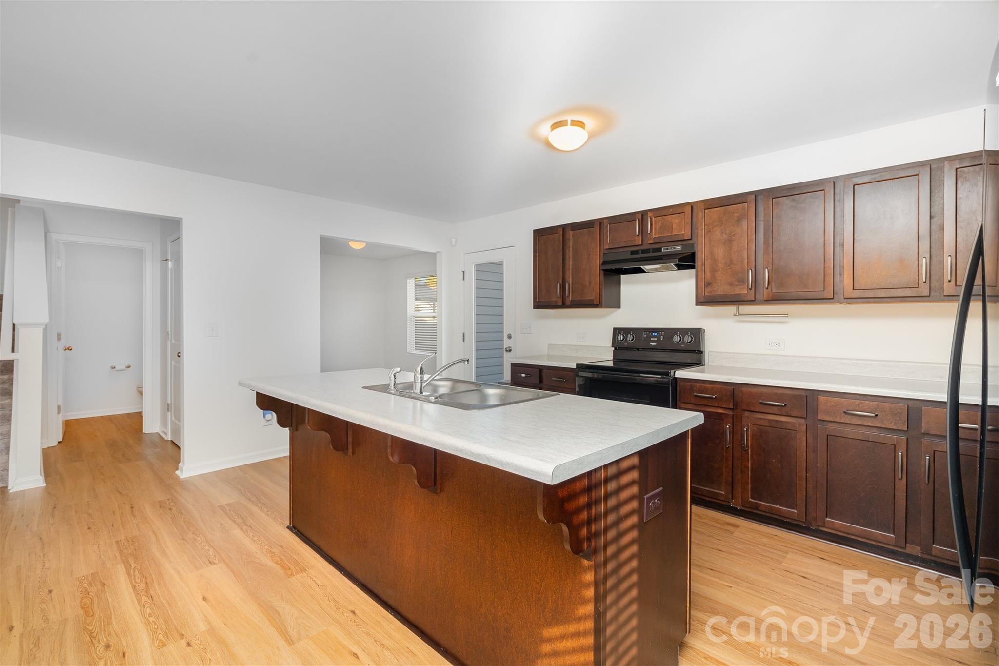1211 Whitehall Hill Road York, SC 29745 - Photo 12 of 39 a kitchen with stainless steel appliances granite countertop a sink stove and refrigerator