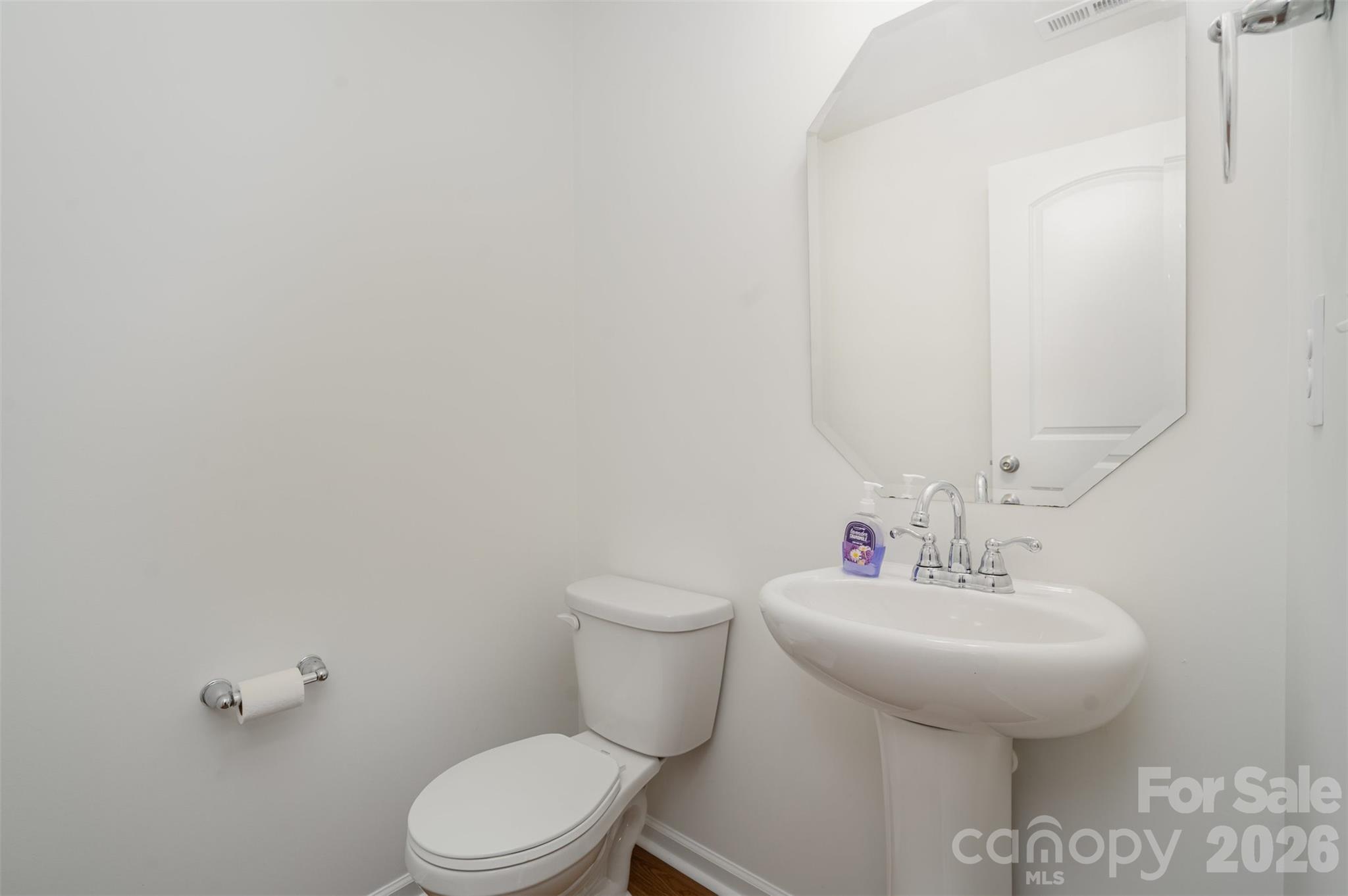 1211 Whitehall Hill Road York, SC 29745 - Photo 15 of 39 a bathroom with a sink a toilet and mirror