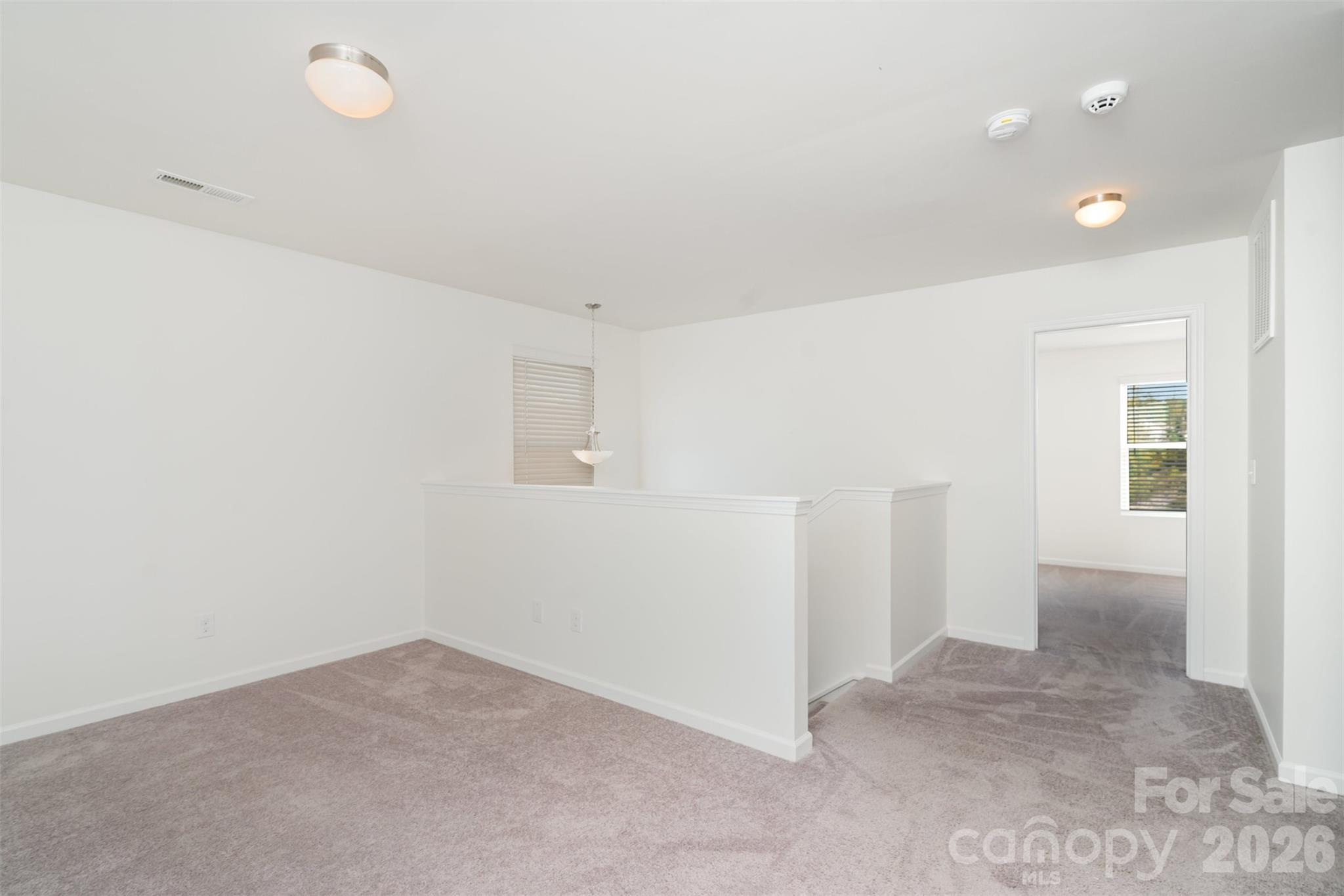 1211 Whitehall Hill Road York, SC 29745 - Photo 18 of 39 wooden floor in an empty room with a window