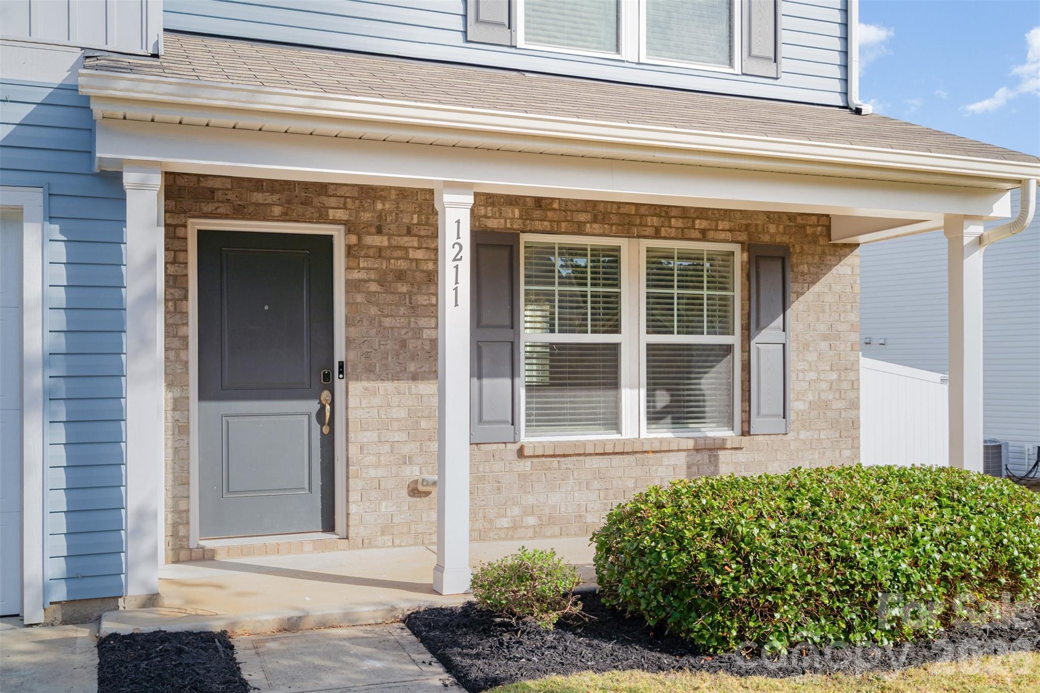 1211 Whitehall Hill Road York, SC 29745 - Photo 3 of 39 a front view of a house with a garden