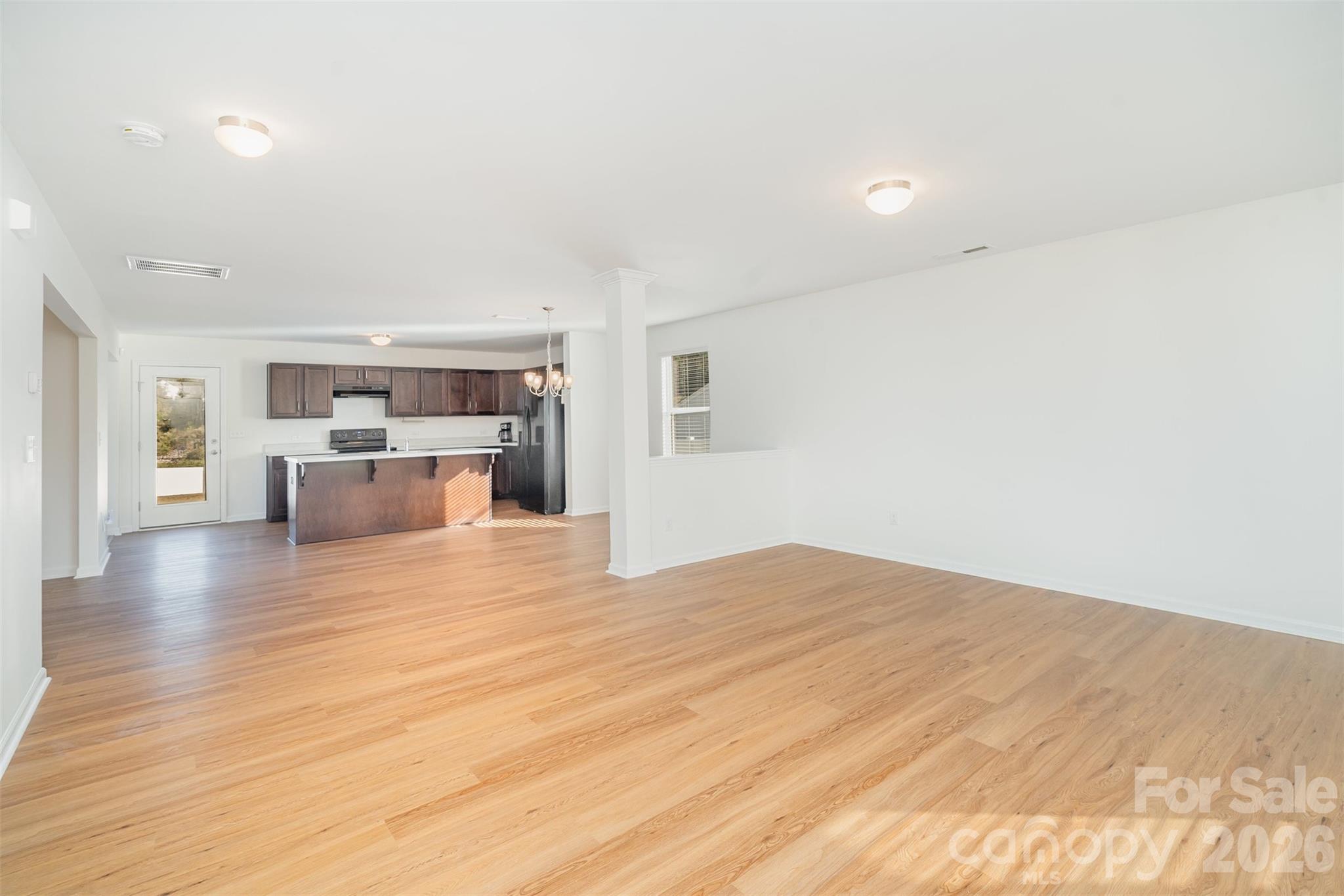 1211 Whitehall Hill Road York, SC 29745 - Photo 5 of 39 a view of kitchen and hall with wooden floor