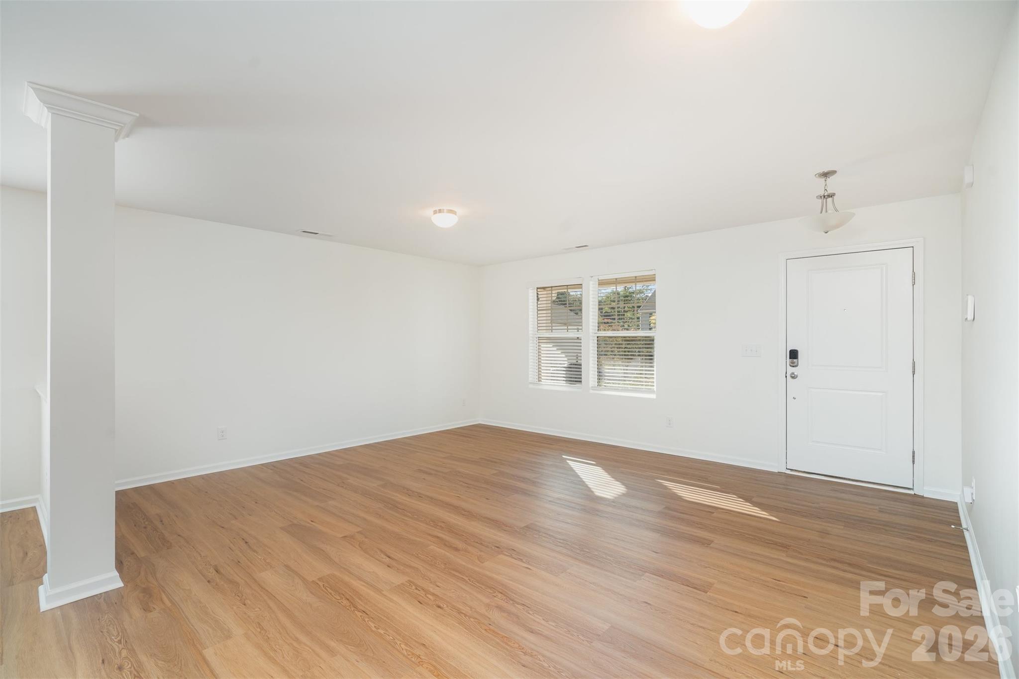 1211 Whitehall Hill Road York, SC 29745 - Photo 8 of 39 a view of empty room with wooden floor and fan