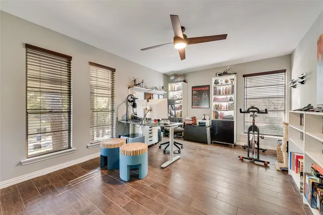 a room with lots of furniture and a large window