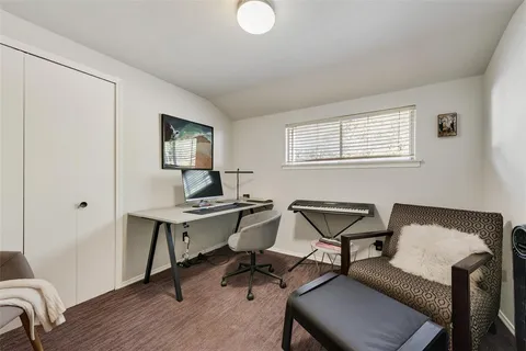 a workspace with furniture and window