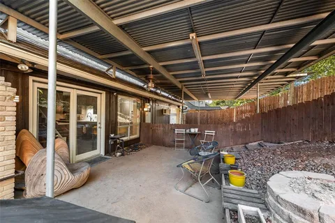 a view of a storage room with a table and chairs