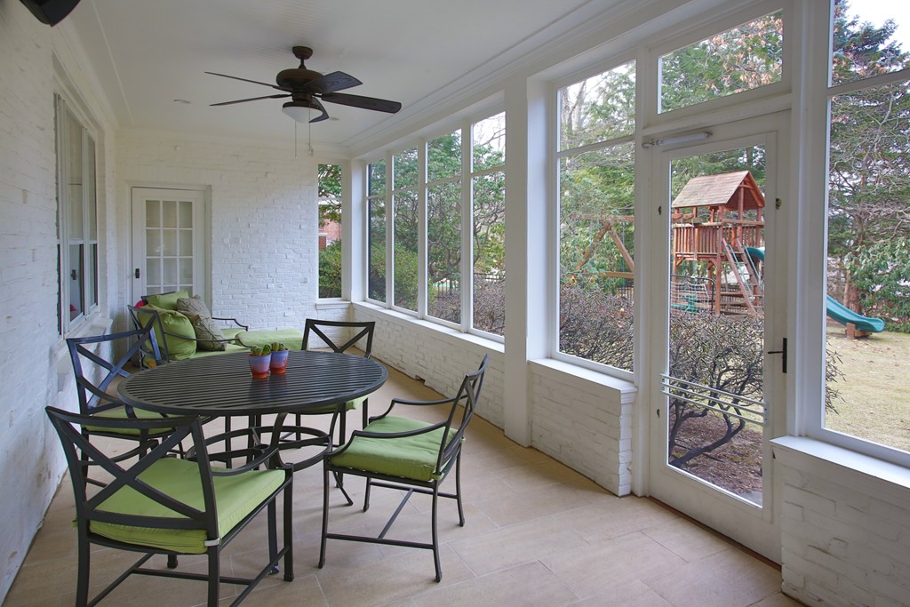 135 Willard Road Brookline, MA 02445 - Photo 12 of 14 a dining room with furniture and large windows