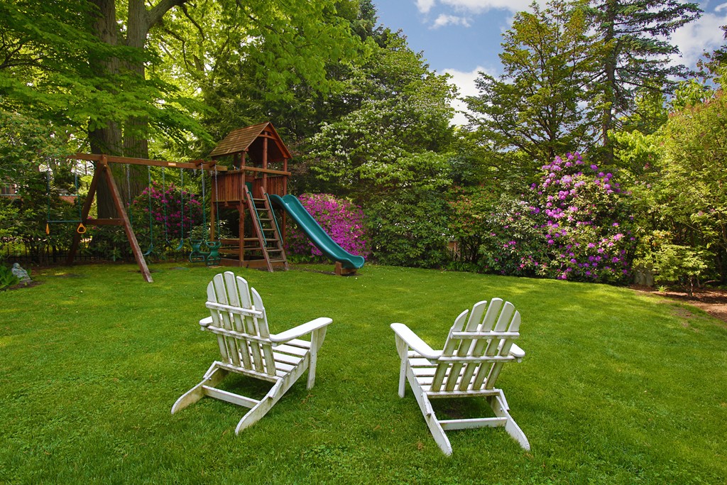 135 Willard Road Brookline, MA 02445 - Photo 14 of 14 a view of a table and chairs in the garden