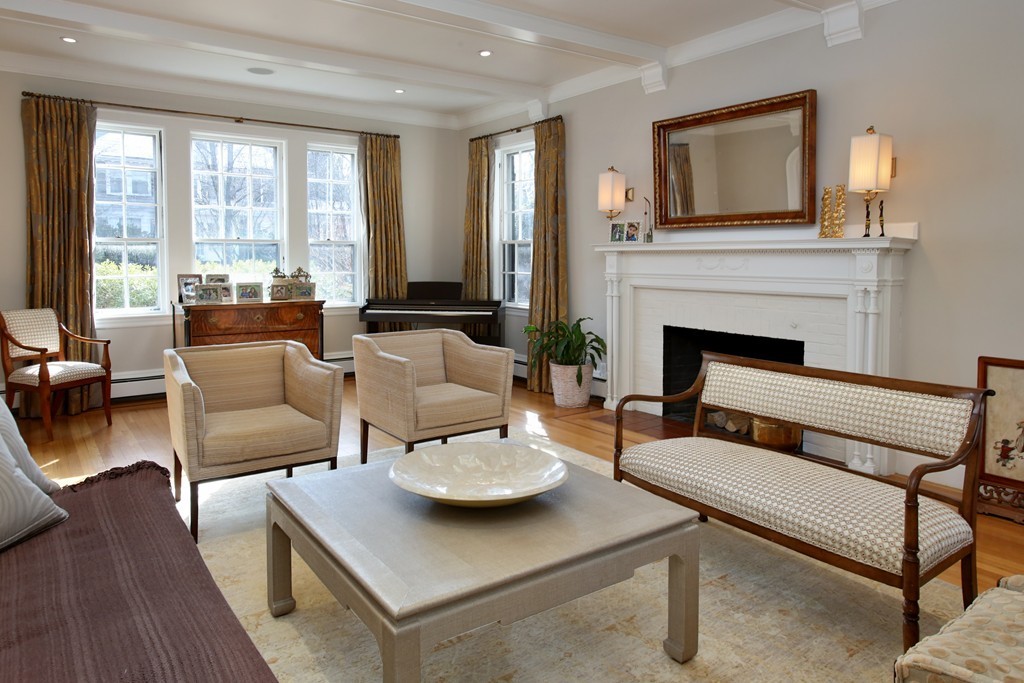 135 Willard Road Brookline, MA 02445 - Photo 2 of 14 a living room with furniture and a fireplace