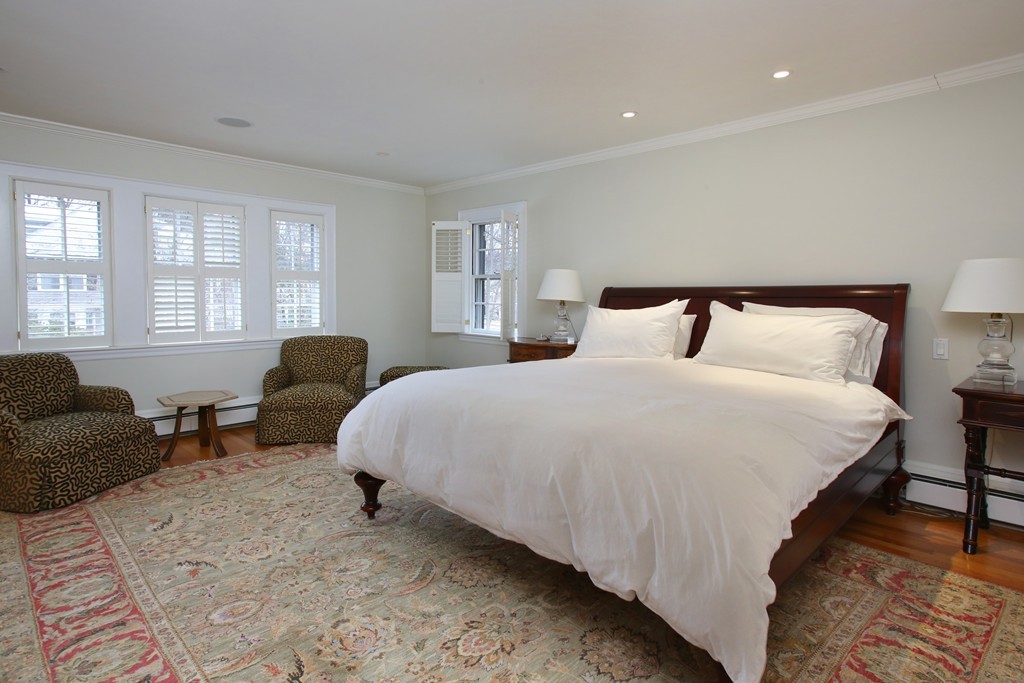 135 Willard Road Brookline, MA 02445 - Photo 7 of 14 a bedroom with bed and a couch