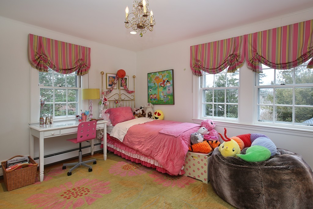 135 Willard Road Brookline, MA 02445 - Photo 9 of 14 a bedroom with a bed and a window