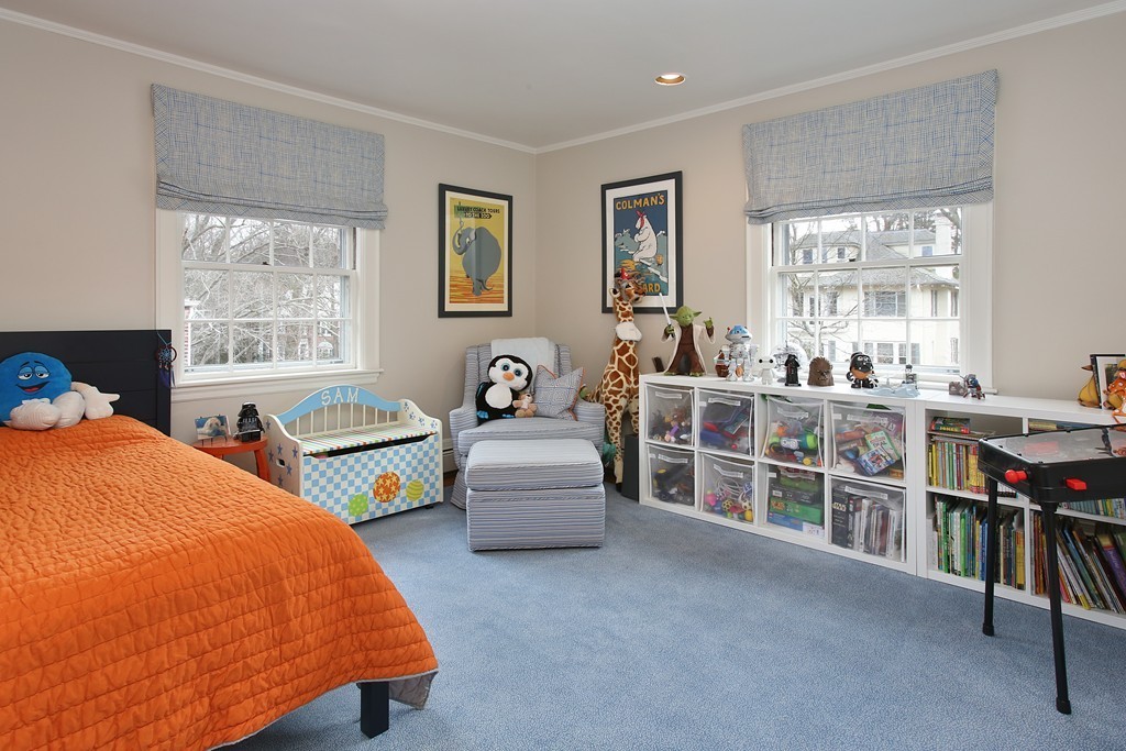 135 Willard Road Brookline, MA 02445 - Photo 10 of 14 a bedroom with a bed and a couch