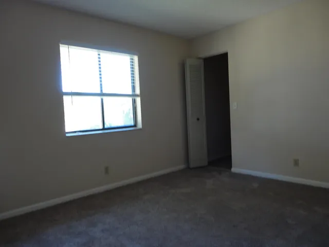 a white toilet sitting next to a bath tub