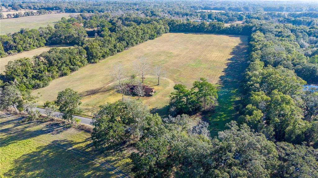 0 Southwest 202nd Street Newberry, FL 32669 - Photo 8 of 12 an aerial view of residential houses with outdoor space and trees