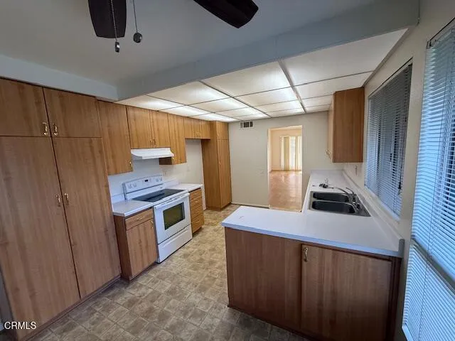 a kitchen with a stove and a sink