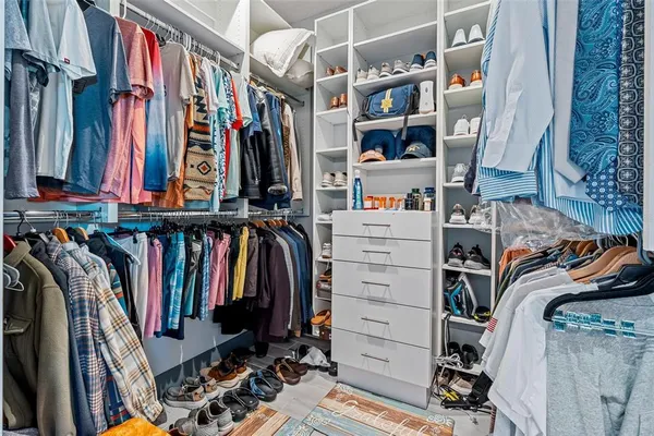 a bedroom with bed and window