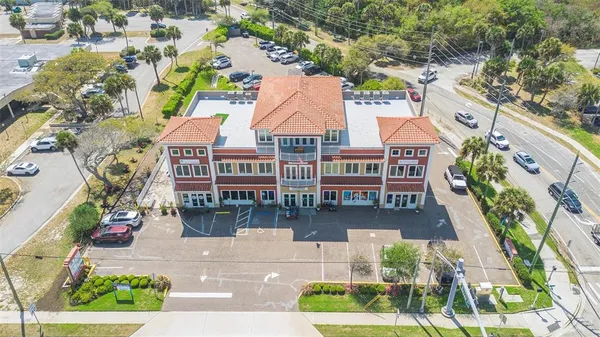 an aerial view of a house with a yard