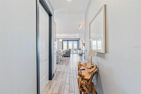 a view of a very nice looking dining room with chairs and furniture