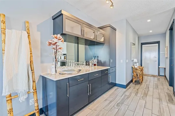 a bathroom with a sink a mirror and a shower
