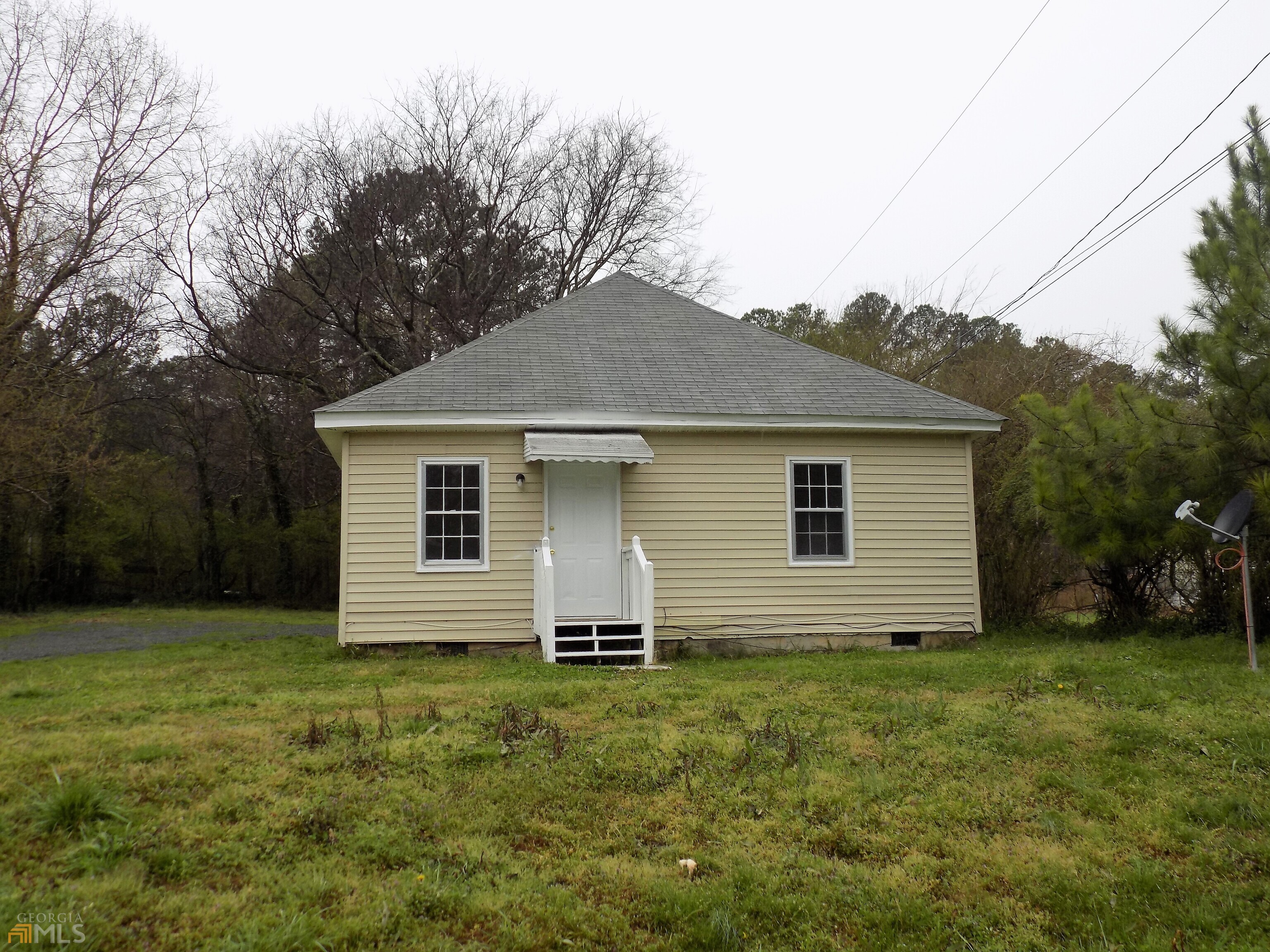 1342 Old Cave Spring Road Southwest Rome, GA 30161 - Photo 1 of 1 a house that has a backyard