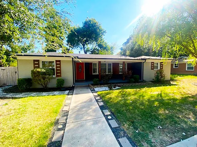 a view of a house with swimming pool