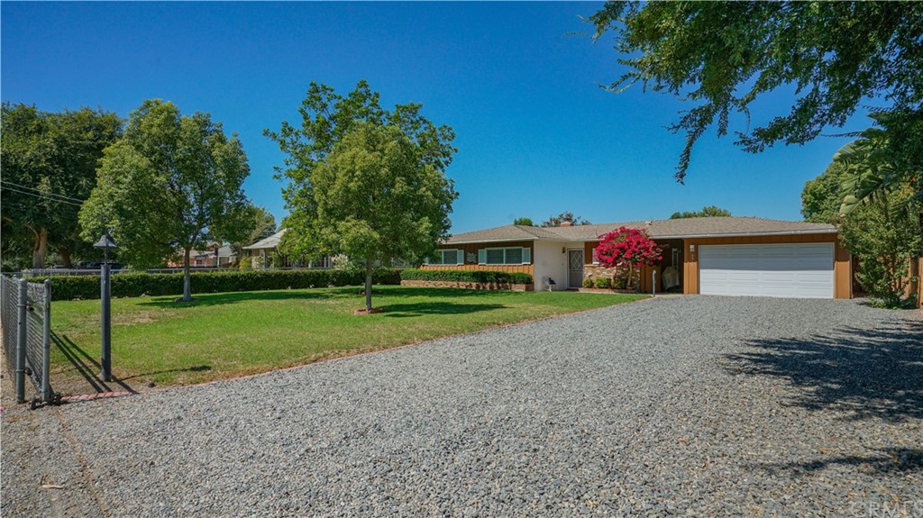 5511 Mountain View Avenue Riverside, CA 92504 - Photo 1 of 1 a view of a house with backyard and trees