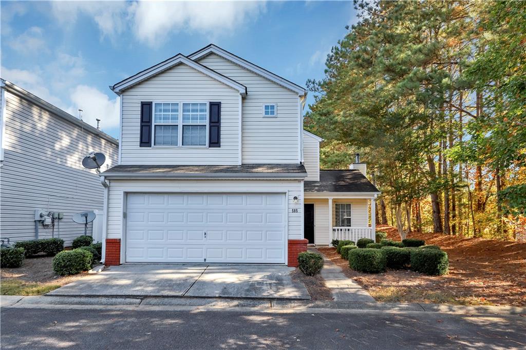 585 Windcroft Circle Northwest Acworth, GA 30101 - Photo 1 of 1 a front view of a house with a yard and garage